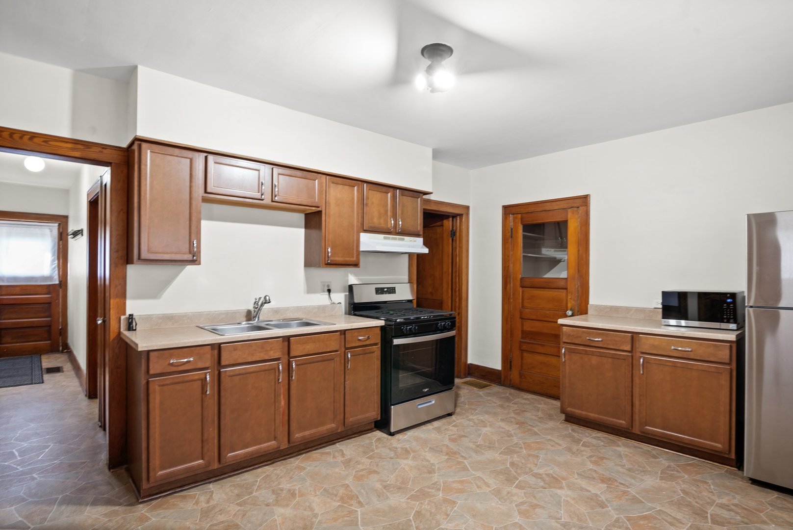 803 South 3rd Street, Unit 1 St. Charles, IL 60174 - Photo 8 of 16 a kitchen with a sink and cabinets