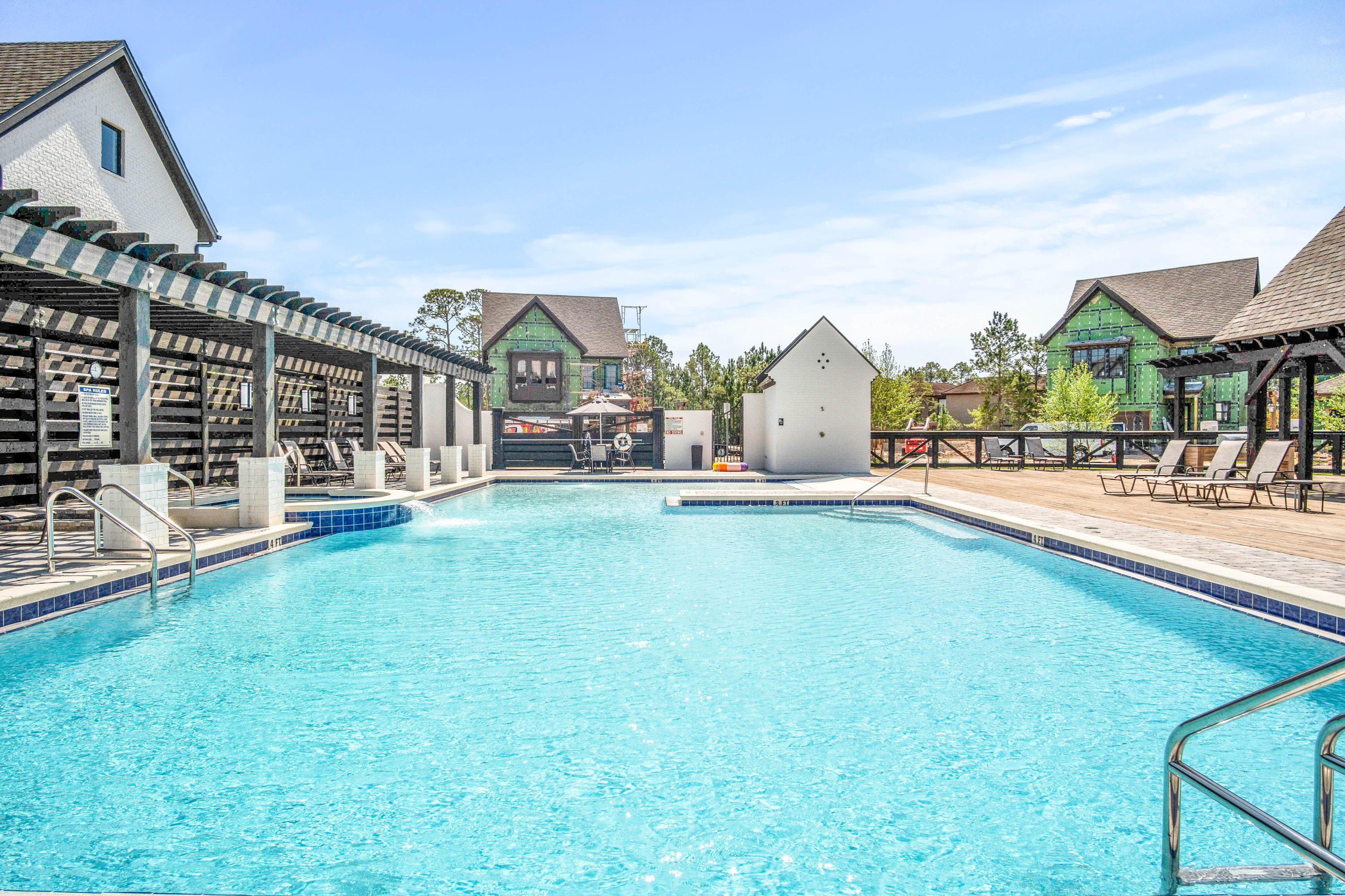 265 Ridgewalk Circle Santa Rosa Beach, FL 32459 - Photo 48 of 62 a view of swimming pool with lawn chairs and a big yard