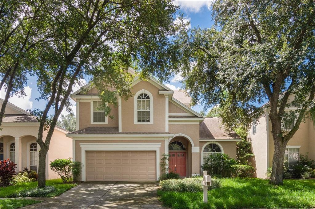 17731 Long Ridge Road Tampa, FL 33647 - Photo 1 of 1 a view of a white house with large trees