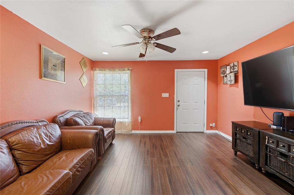 3624 Redbird Street Bellmead, TX 76705 - Photo 5 of 20 a living room with furniture and a flat screen tv