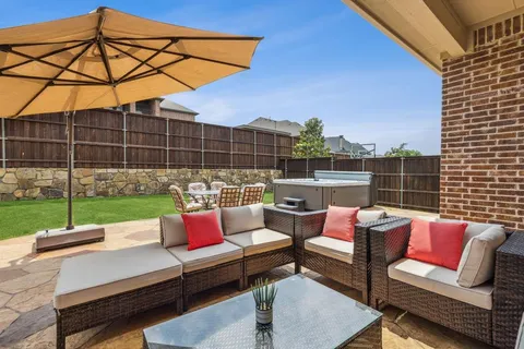 a view of backyard with swimming pool and outdoor seating