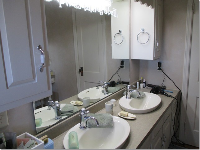 24890 Star Road Tampico, IL 61283 - Photo 17 of 26 a bathroom with a sink and a mirror