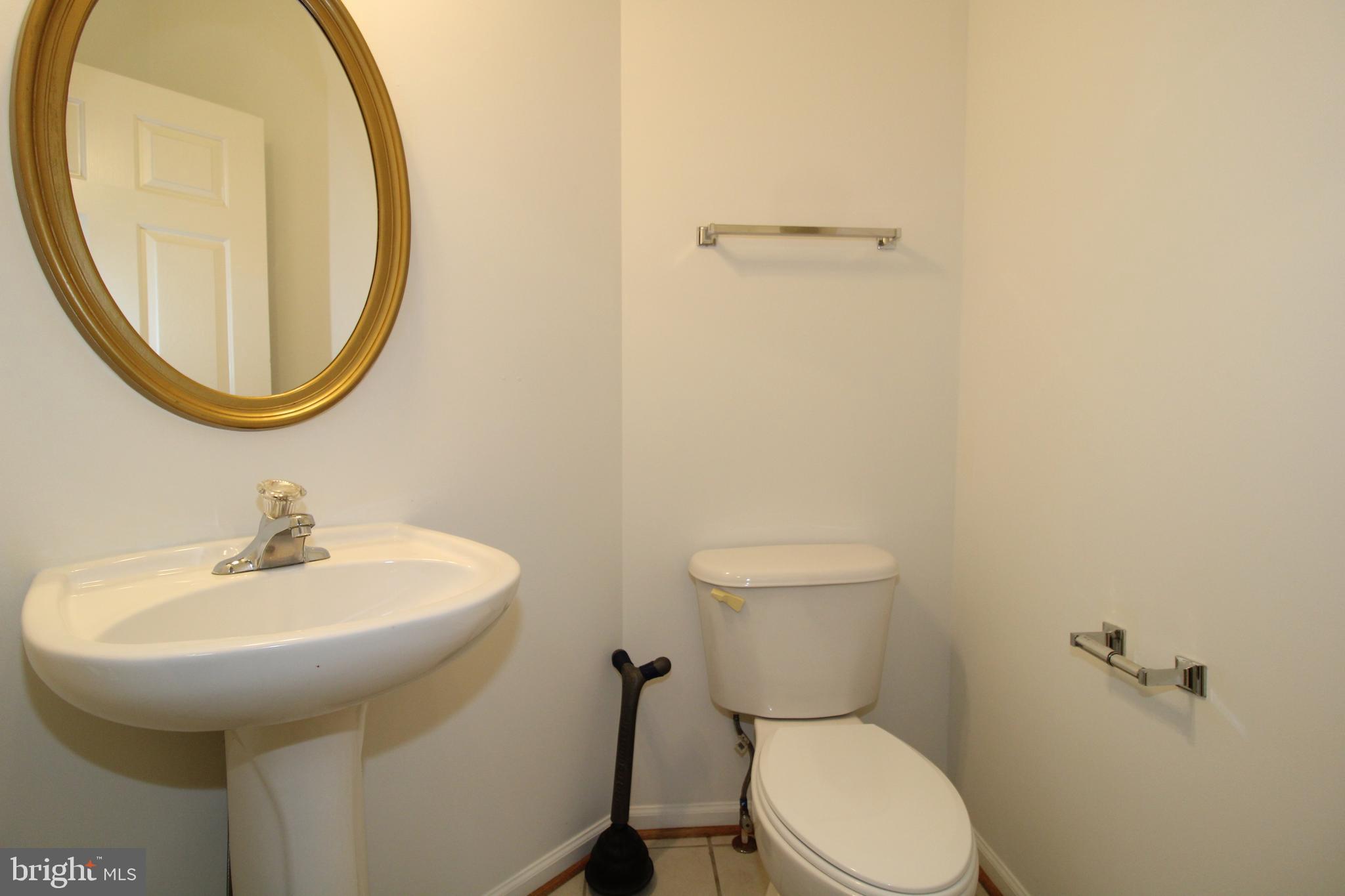 17730 Perlite Way Hagerstown, MD 21740 - Photo 2 of 21 a bathroom with a sink a mirror and a toilet