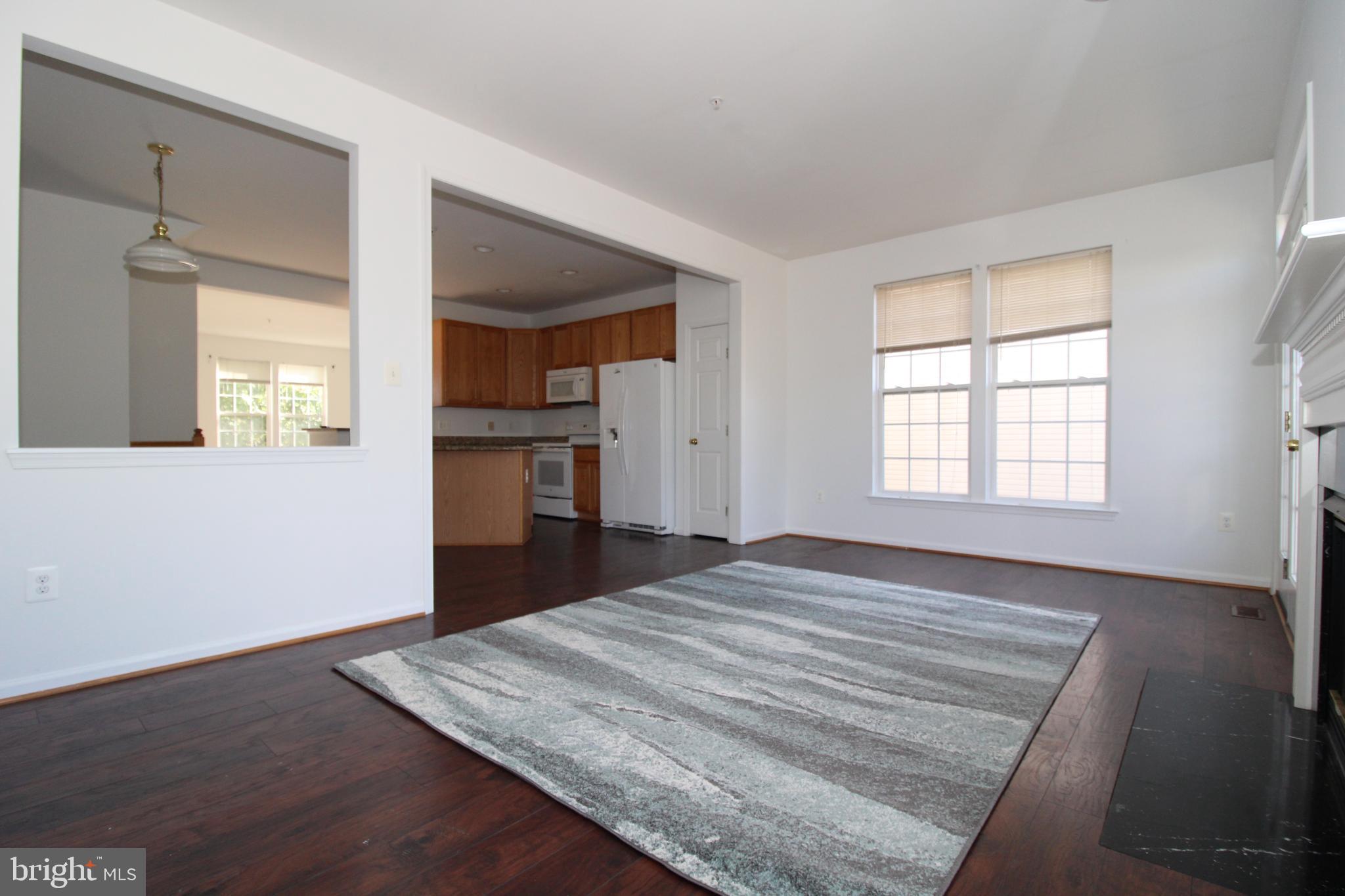 17730 Perlite Way Hagerstown, MD 21740 - Photo 8 of 21 an empty room with wooden floor and windows