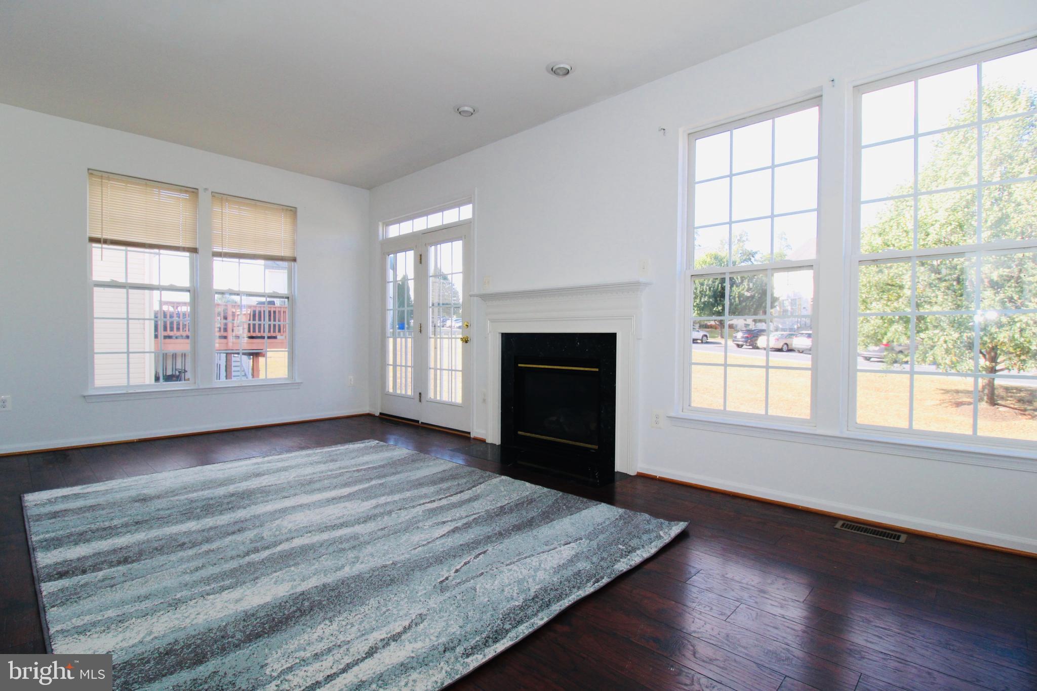 17730 Perlite Way Hagerstown, MD 21740 - Photo 9 of 21 a view of an empty room with wooden floor and a window