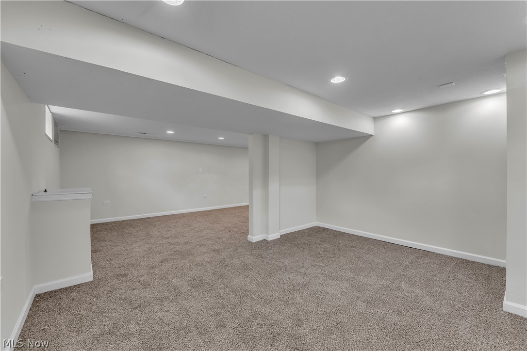 2540 Charney Road University Heights, OH 44118 - Photo 38 of 44 Spacious room featuring neutral carpeting, recessed lighting, and white baseboards