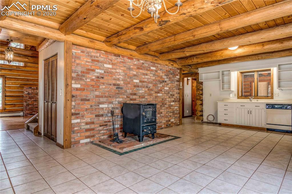17940 Smugglers Road Monument, CO 80132 - Photo 15 of 40 Wood burning stove in kitchen