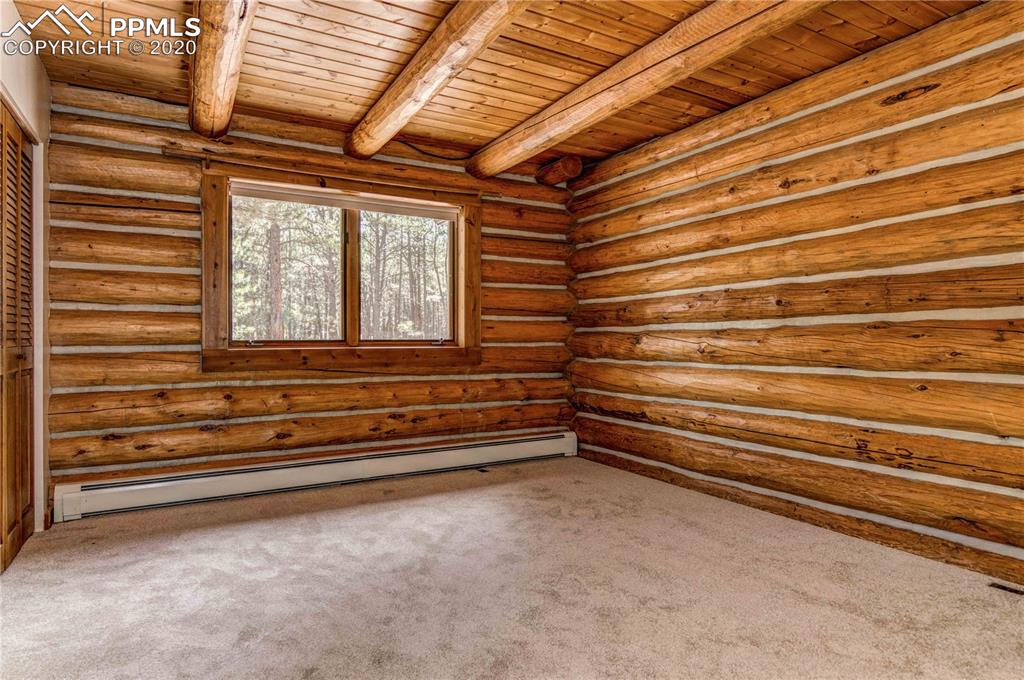17940 Smugglers Road Monument, CO 80132 - Photo 19 of 40 Main floor bedroom