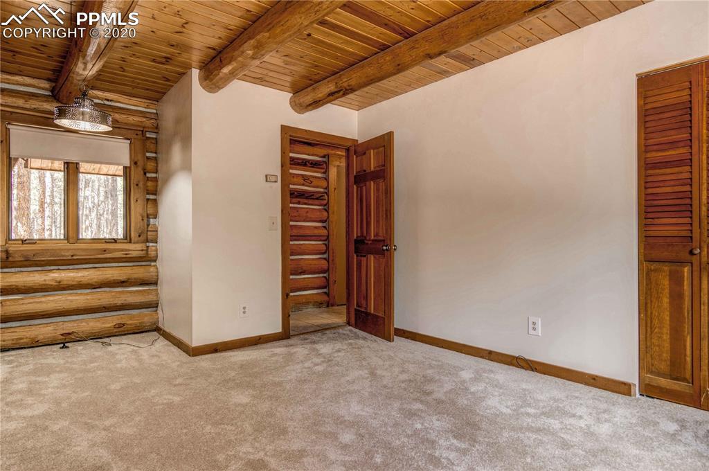 17940 Smugglers Road Monument, CO 80132 - Photo 20 of 40 Main floor bedroom