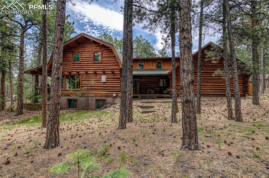 17940 Smugglers Road Monument, CO 80132 - Photo 5 of 40 Escape to your spacious log cabin in the woods