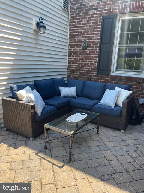 235 Hopkins Road Haddonfield, NJ 08033 - Photo 38 of 47 a view of a patio with couches and a fire pit