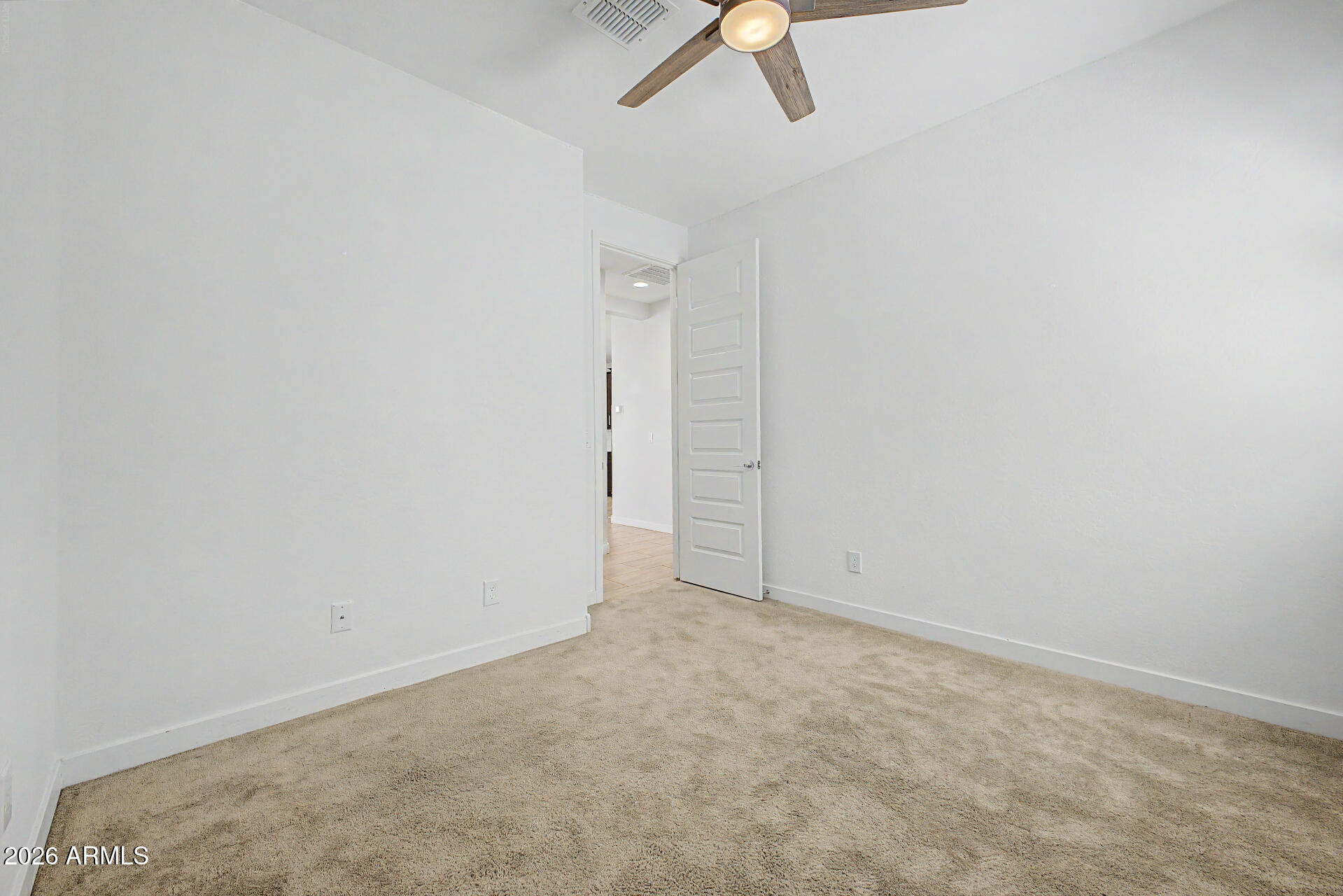23080 East Stacey Road Queen Creek, AZ 85142 - Photo 25 of 42 an empty room with a empty space and a ceiling fan