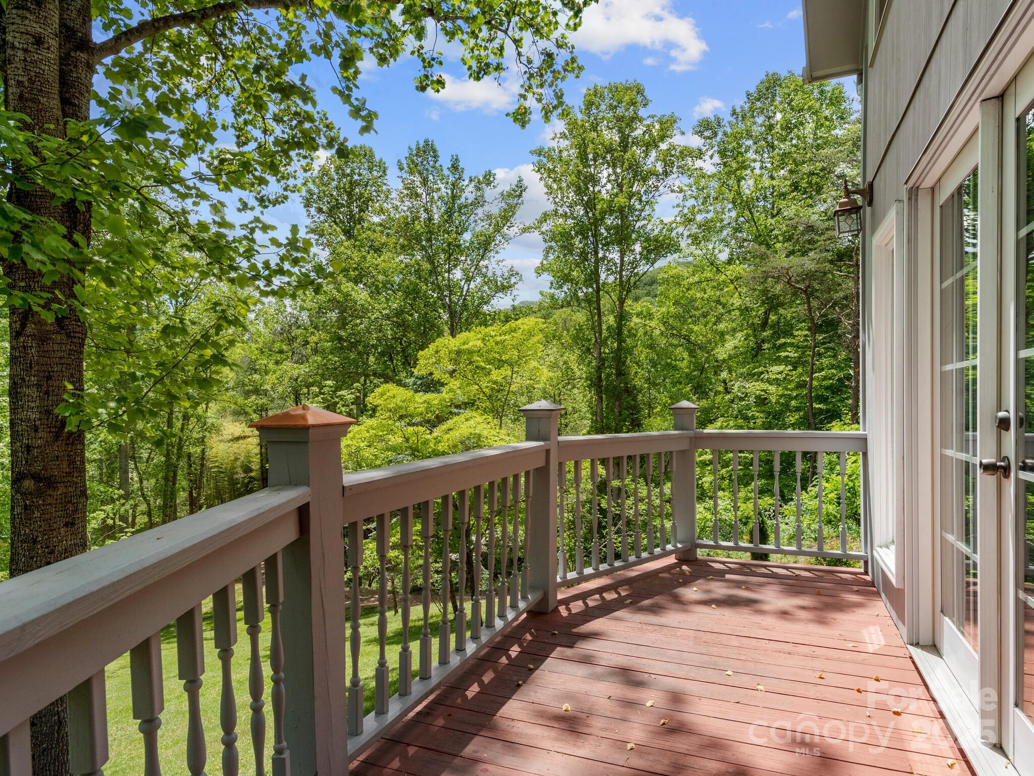 116 Sams Branch Road Candler, NC 28715 - Photo 18 of 47 a view of balcony with wooden floor and fence