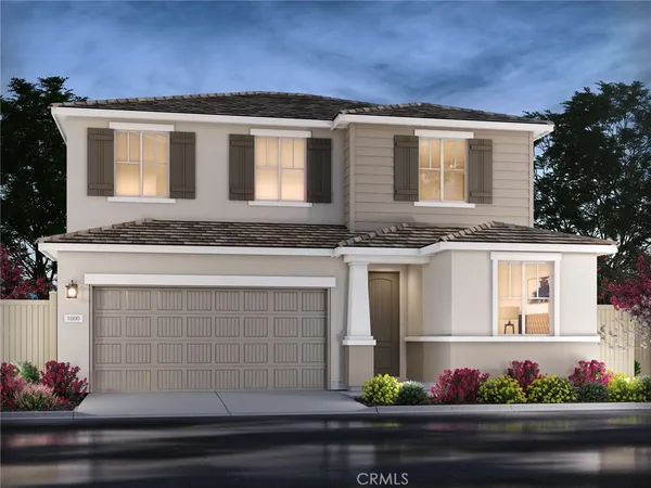 a front view of a house with flowers