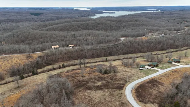a view of a yard with wooden fence