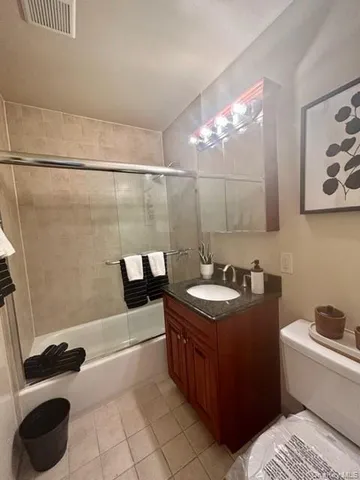 a bathroom with a sink a toilet and bathtub