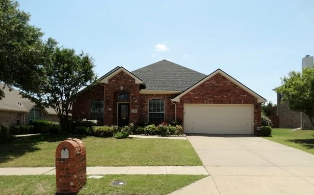 15785 Scenic Road Frisco, TX 75035 - Photo 1 of 21 a front view of a house with a yard and garage