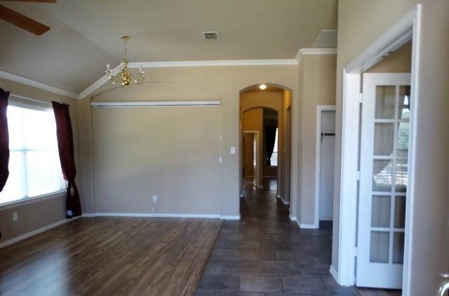 15785 Scenic Road Frisco, TX 75035 - Photo 4 of 21 a view of a hallway with wooden walls and windows