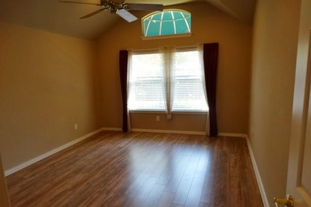 15785 Scenic Road Frisco, TX 75035 - Photo 10 of 21 an empty room with wooden floor and windows