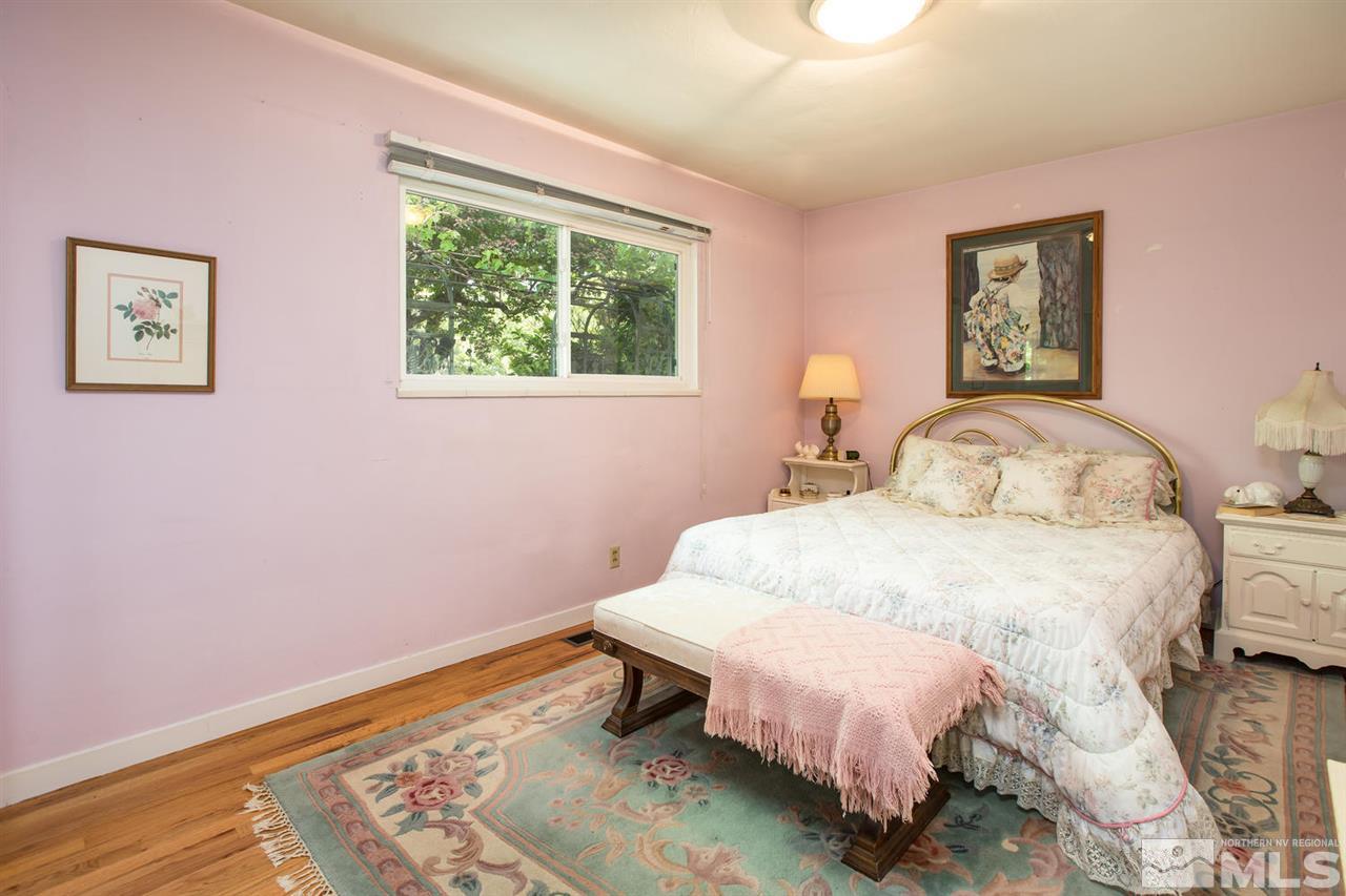 735 Brown Street Reno, NV 89509 - Photo 11 of 19 a bedroom with a bed and a window