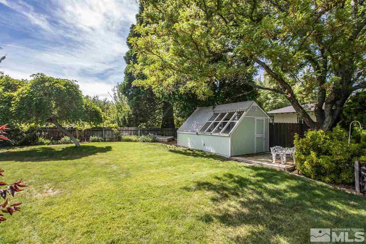 735 Brown Street Reno, NV 89509 - Photo 13 of 19 a view of a house with swimming pool and yard