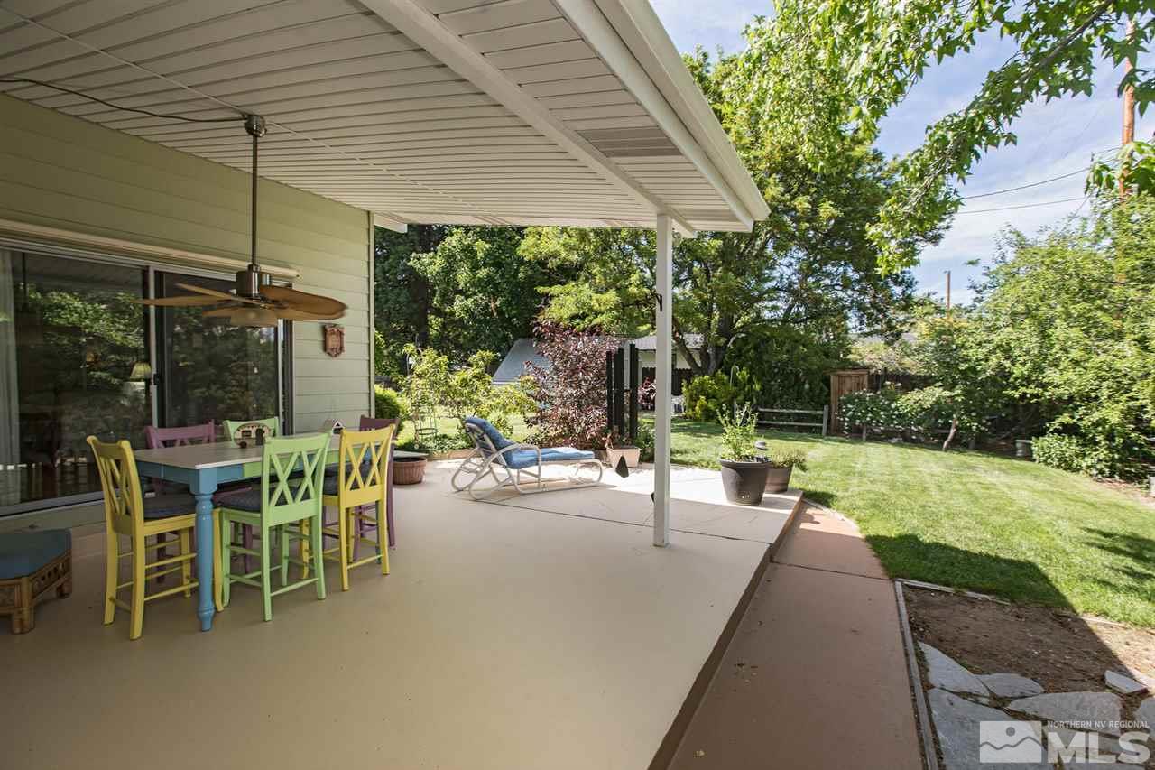 735 Brown Street Reno, NV 89509 - Photo 18 of 19 a view of a patio with table and chairs under an umbrella
