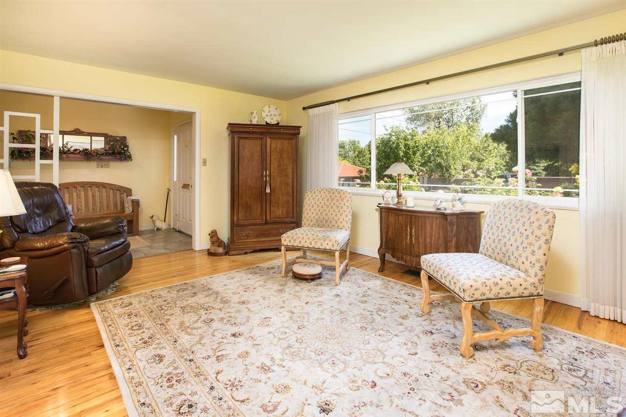 735 Brown Street Reno, NV 89509 - Photo 3 of 19 a living room with a couch and a table