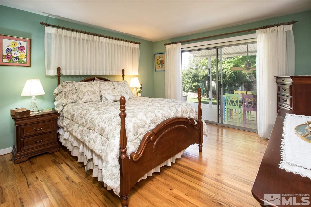 735 Brown Street Reno, NV 89509 - Photo 9 of 19 a bed sitting in a bedroom next to a window