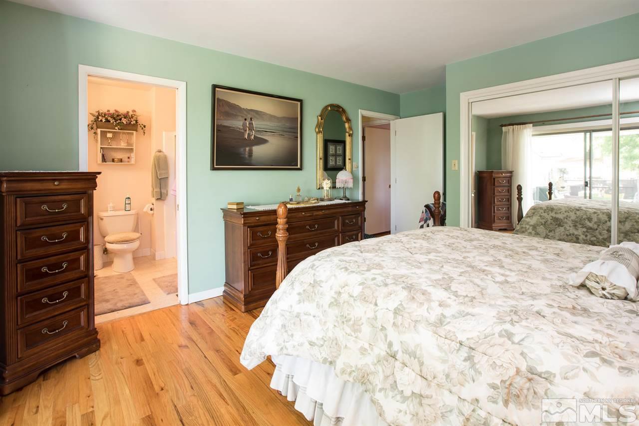 735 Brown Street Reno, NV 89509 - Photo 10 of 19 a bedroom with a bed and a flat screen tv