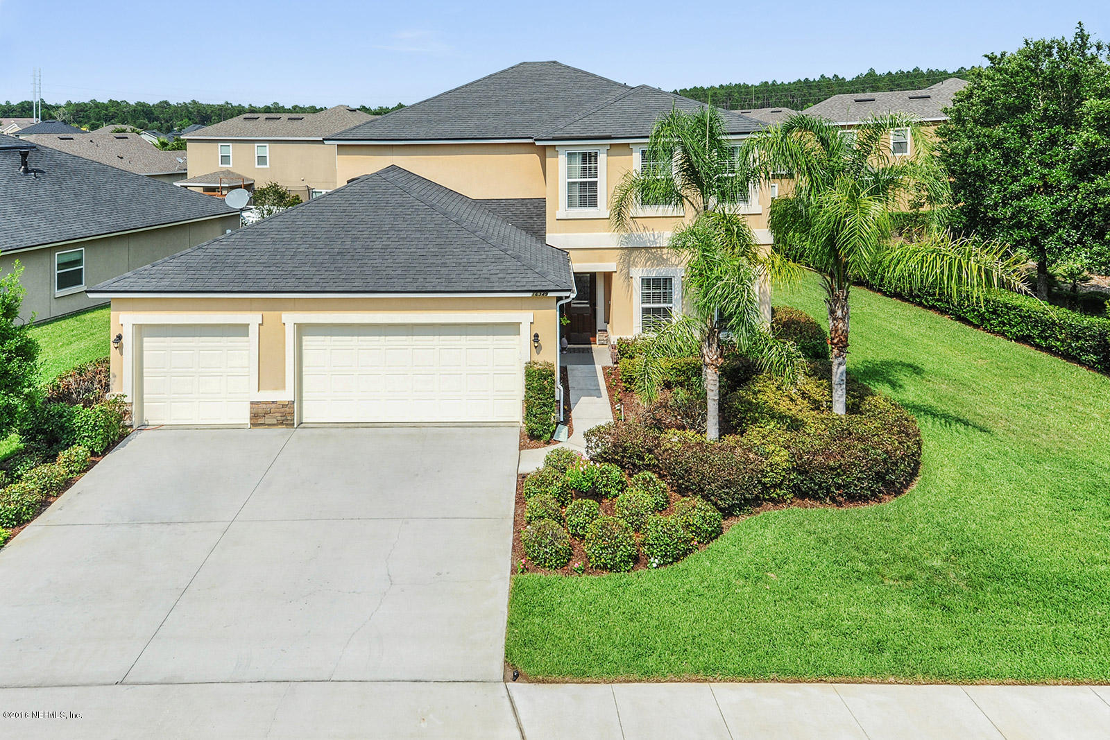 16349 Tisons Bluff Road Jacksonville, FL 32218 - Photo 3 of 31 a front view of a house with a yard