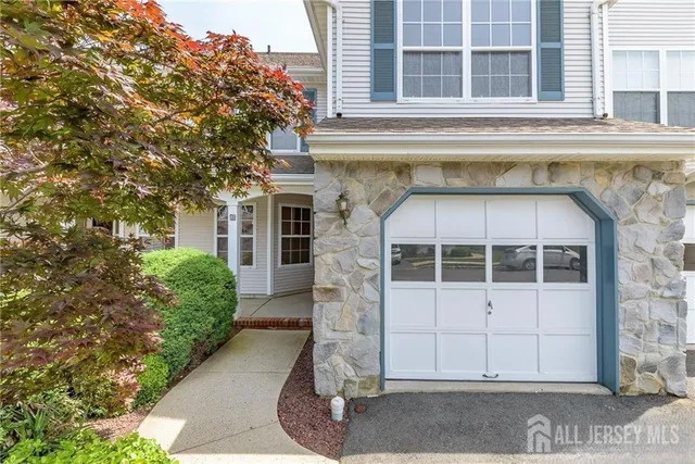 a front view of a house with a garage
