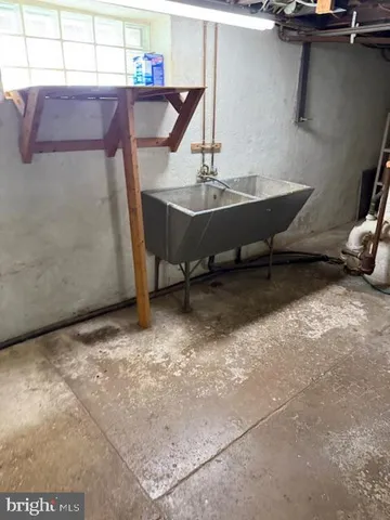 a view of a house with snow on the road