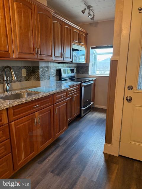 2920 Kutztown Road Reading, PA 19605 - Photo 5 of 21 a kitchen with stainless steel appliances granite countertop wooden cabinets a sink and dishwasher with wooden floor