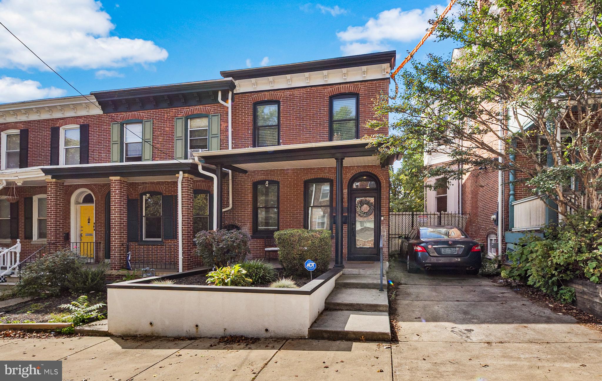 a front view of a house with yard