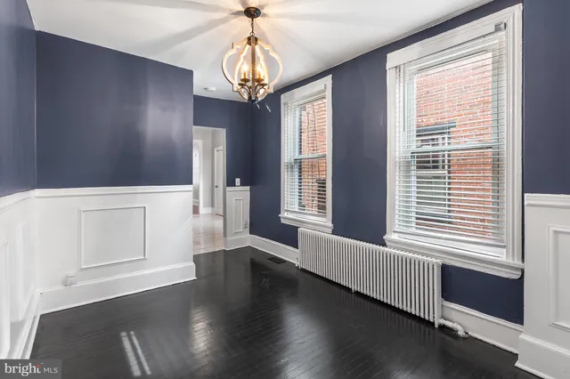 a view of a windows and chandelier in a room