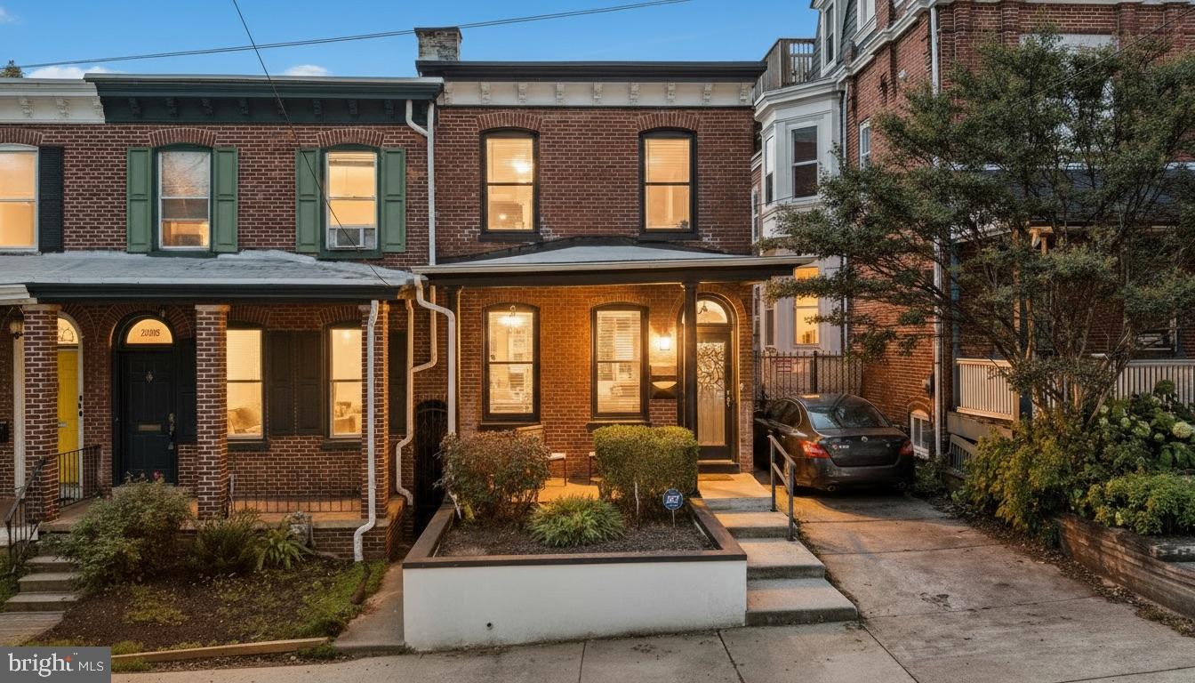 1204 West 8th Street Wilmington, DE 19806 - Photo 3 of 35 a building exterior with furniture