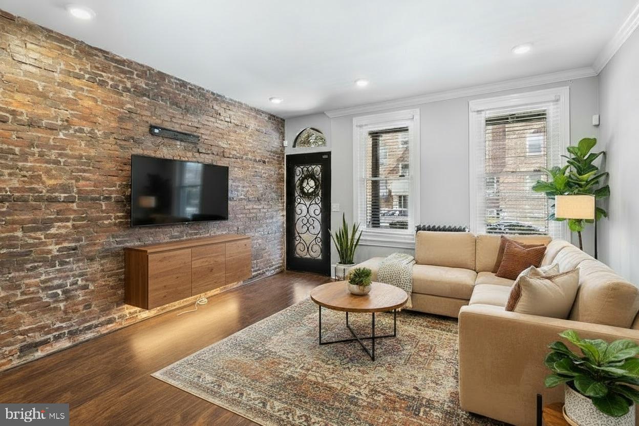 1204 West 8th Street Wilmington, DE 19806 - Photo 5 of 35 a living room with furniture and a flat screen tv