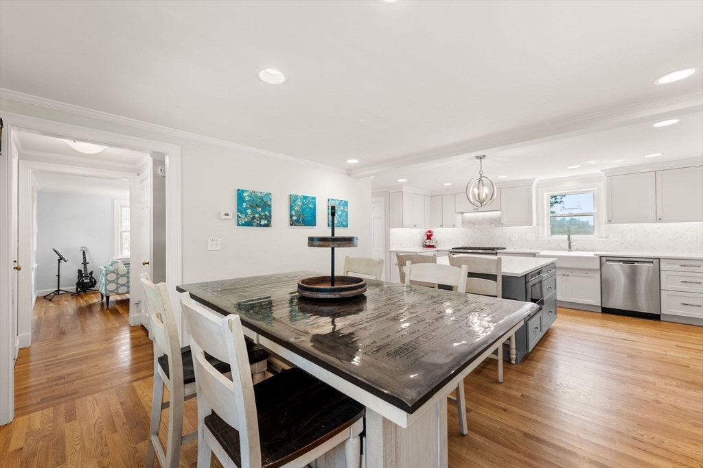 166 Hillcrest Road Needham, MA 02492 - Photo 11 of 36 a kitchen with stainless steel appliances granite countertop a stove a sink a refrigerator and white cabinets