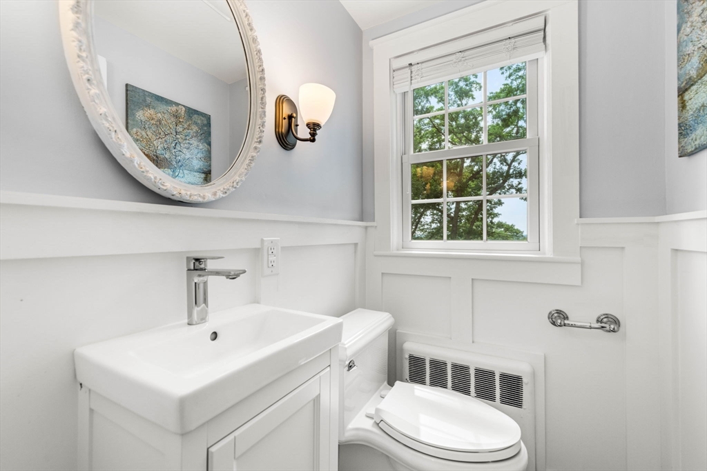 166 Hillcrest Road Needham, MA 02492 - Photo 14 of 36 a bathroom with a toilet sink and mirror