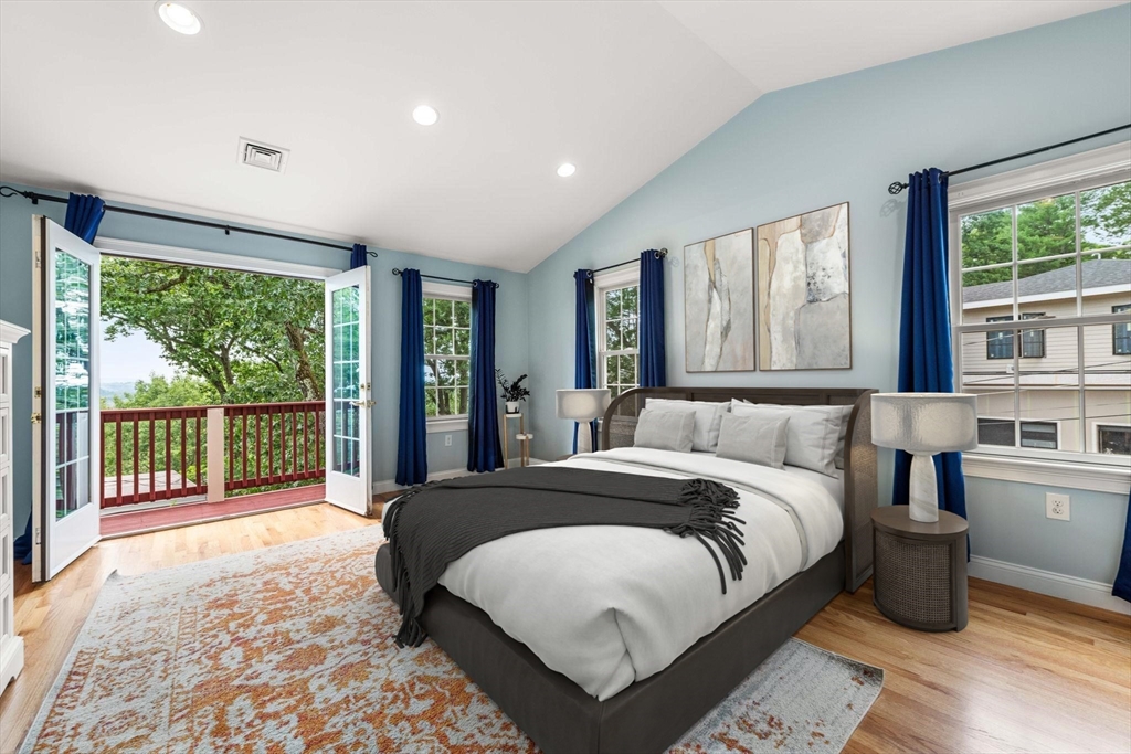 166 Hillcrest Road Needham, MA 02492 - Photo 16 of 36 a spacious bedroom with a large bed and a large window