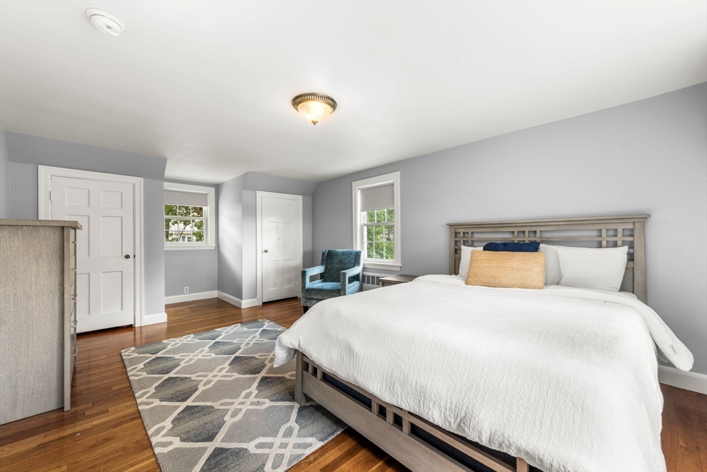166 Hillcrest Road Needham, MA 02492 - Photo 19 of 36 a bedroom with a bed and wooden floor