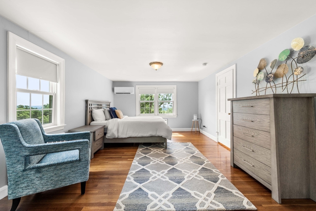 166 Hillcrest Road Needham, MA 02492 - Photo 20 of 36 a bedroom with a bed and wooden floor