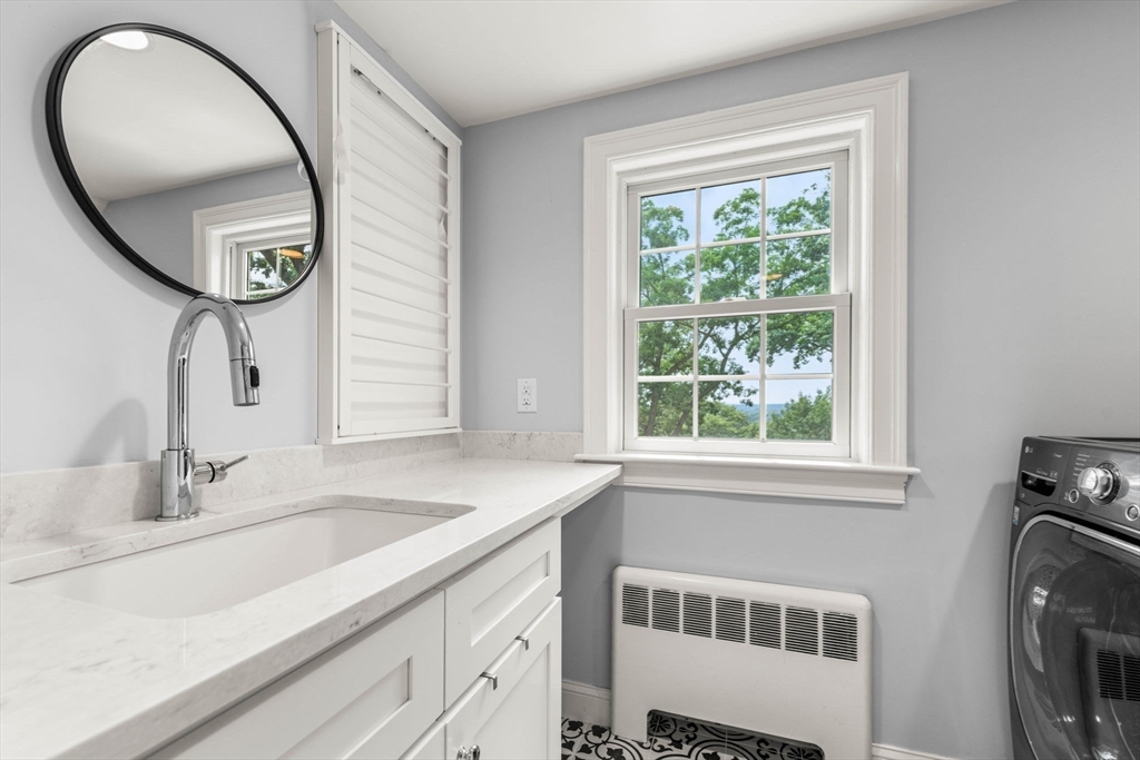 166 Hillcrest Road Needham, MA 02492 - Photo 21 of 36 a bathroom with a sink and a mirror