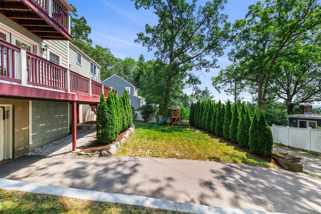 166 Hillcrest Road Needham, MA 02492 - Photo 30 of 36 a view of a street with a building in the background