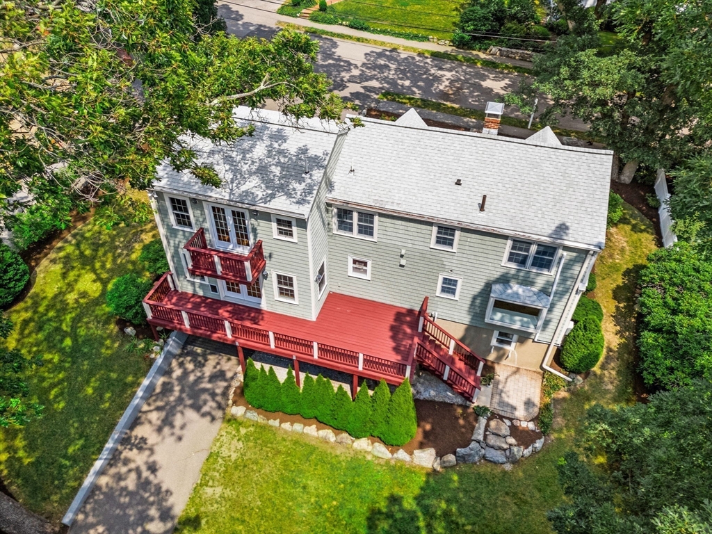 166 Hillcrest Road Needham, MA 02492 - Photo 32 of 36 an aerial view of a house with swimming pool and a yard
