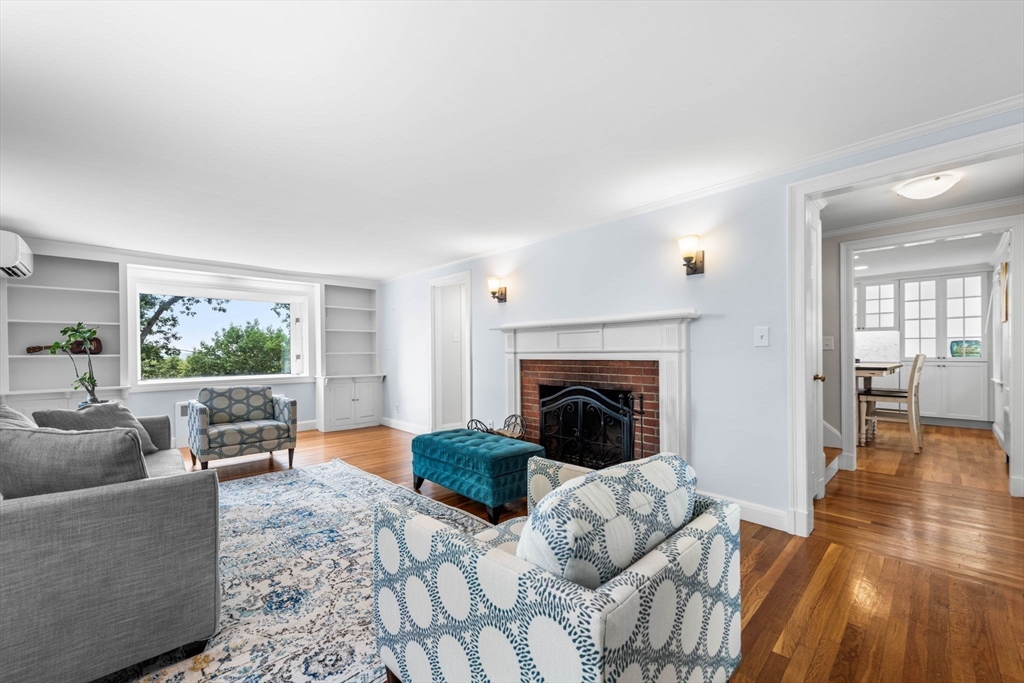 166 Hillcrest Road Needham, MA 02492 - Photo 5 of 36 a living room with furniture and a fireplace