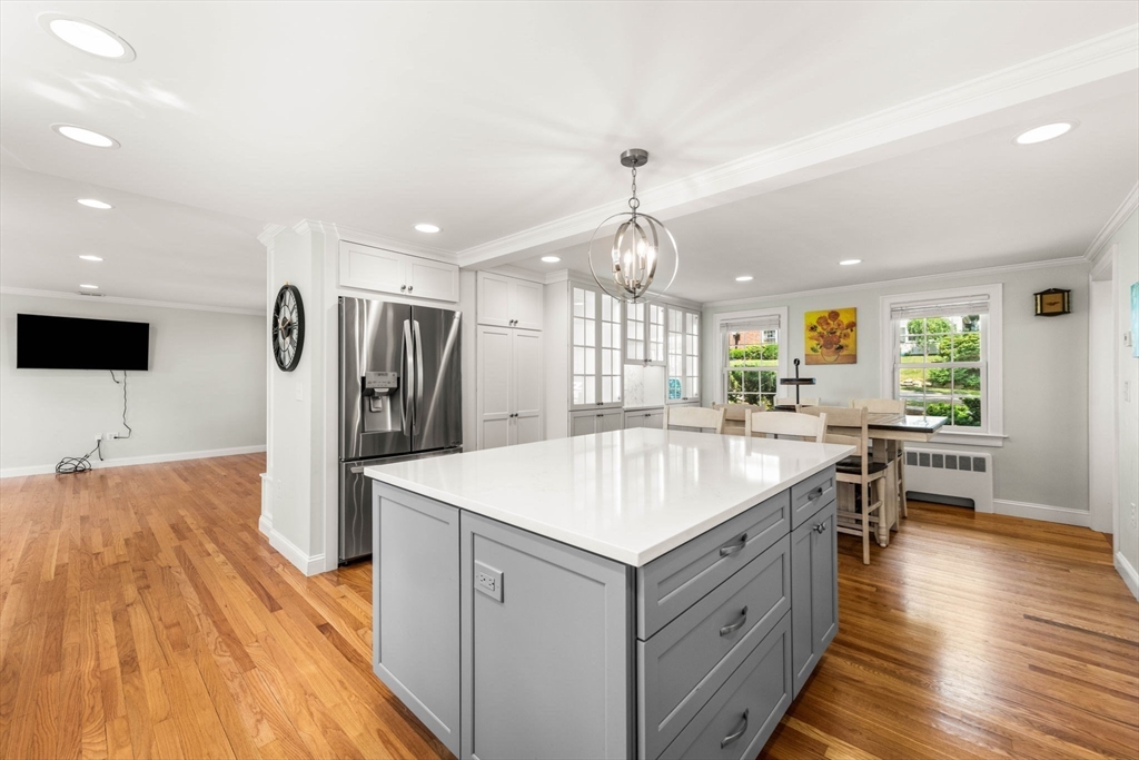 166 Hillcrest Road Needham, MA 02492 - Photo 8 of 36 a large kitchen with kitchen island a stove a sink a refrigerator and a center island