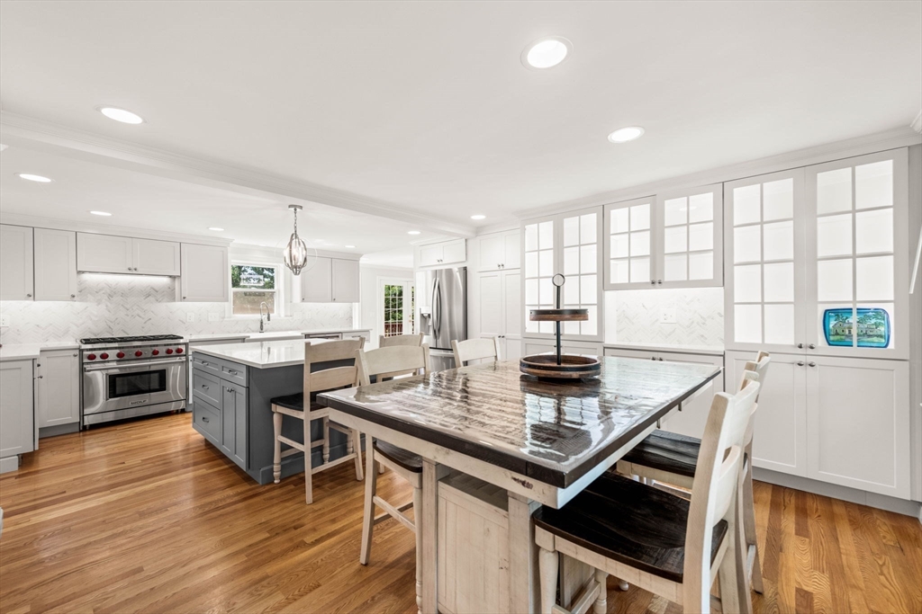 166 Hillcrest Road Needham, MA 02492 - Photo 10 of 36 a kitchen with stainless steel appliances a stove sink and cabinets