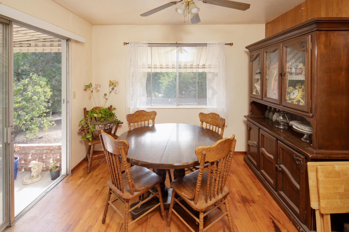 7600 Pine Tree Way Salinas, CA 93907 - Photo 34 of 43 a dining room with furniture a window and wooden floor