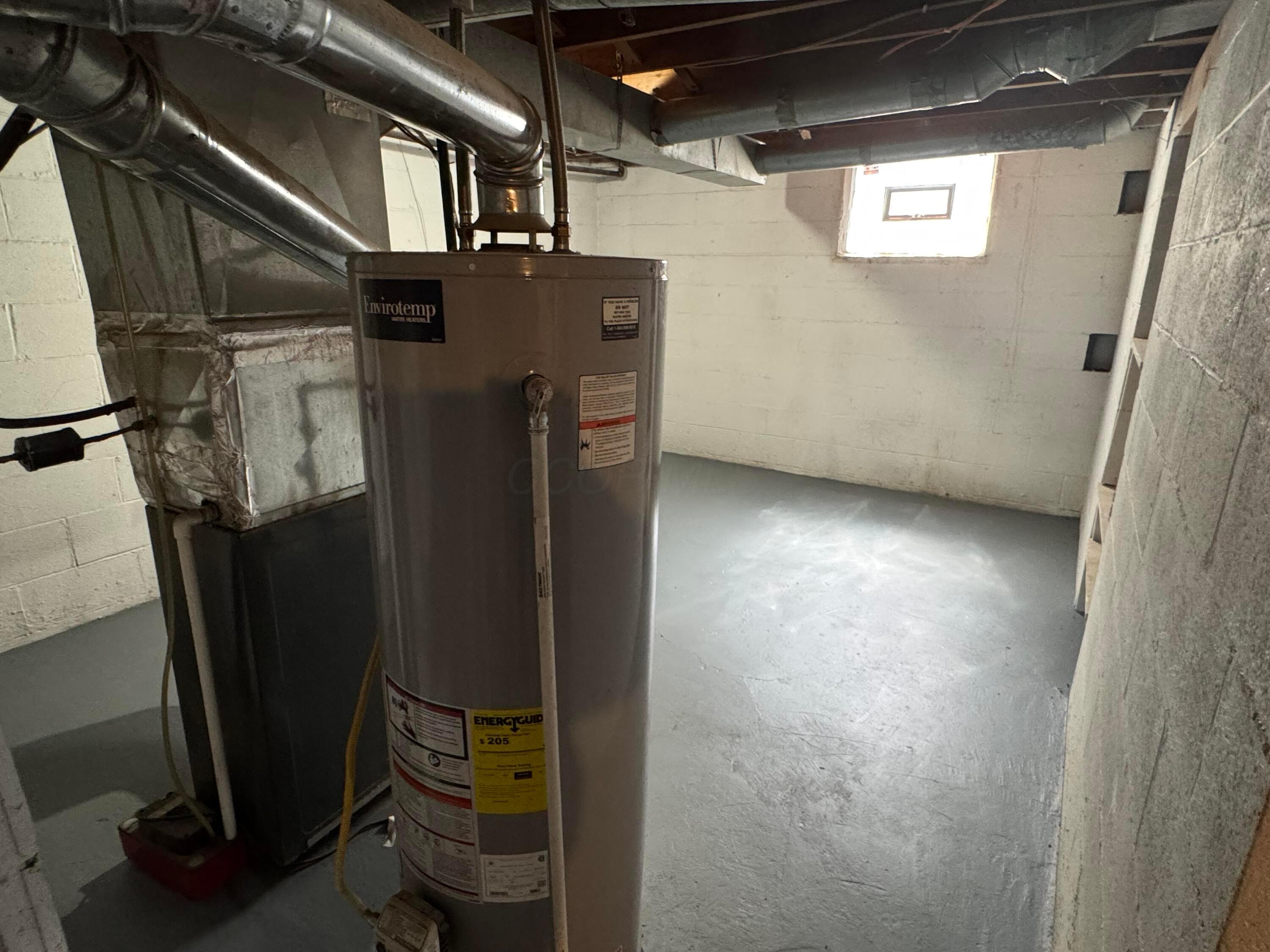 2499 Howey Road Columbus, OH 43211 - Photo 9 of 13 Furnace and hot water tank utility room